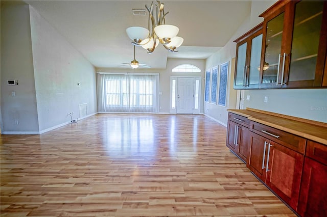 2730 SW 162nd Street Rd, Ocala, FL 34473 - unfurnished dining area featuring a chandelier, light wood-style flooring, a ceiling fan, and vaulted ceiling