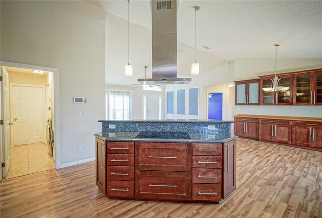 2730 SW 162nd Street Rd, Ocala, FL 34473 - kitchen featuring ventilation hood, black electric stovetop, light wood-style floors, pendant lighting, and glass insert cabinets