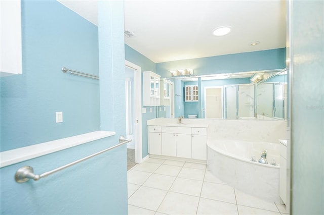 2730 SW 162nd Street Rd, Ocala, FL 34473 - bathroom with a garden tub, vanity, tile patterned flooring, and a stall shower