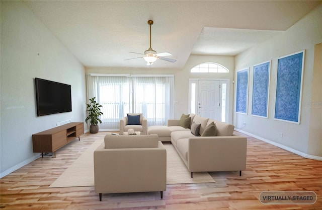 2730 SW 162nd Street Rd, Ocala, FL 34473 - living area with light wood finished floors, a ceiling fan, and vaulted ceiling