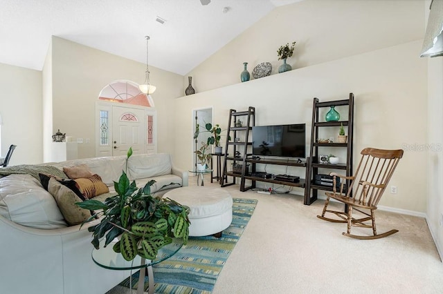 carpeted living area featuring visible vents and high vaulted ceiling