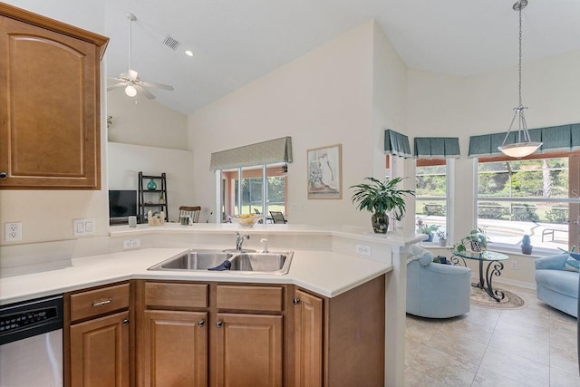 kitchen with dishwasher, a sink, a peninsula, open floor plan, and ceiling fan