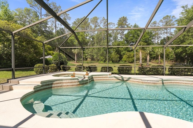 view of swimming pool with a lanai, a pool with connected hot tub, and a patio