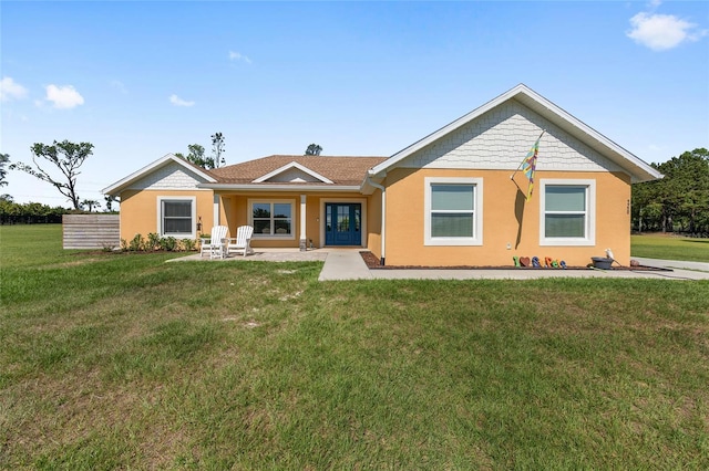 9950 NW 11th Ter, Ocala, FL 34475 - rear view of house with a lawn, french doors, and stucco siding