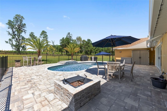 9950 NW 11th Ter, Ocala, FL 34475 - view of pool with a fire pit, a patio, a fenced backyard, and outdoor dining space