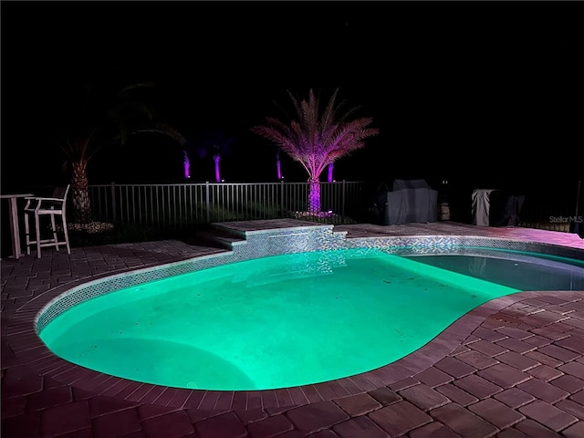 9950 NW 11th Ter, Ocala, FL 34475 - pool at twilight with a patio