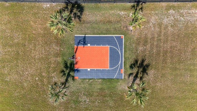 9950 NW 11th Ter, Ocala, FL 34475 - view of basketball court with basketball hoop and a lawn