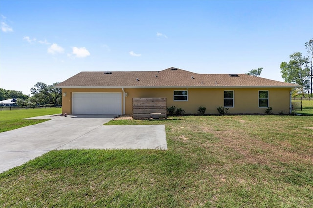 9950 NW 11th Ter, Ocala, FL 34475 - back of property featuring stucco siding, an attached garage, and driveway
