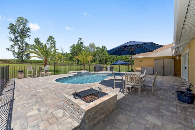 9950 NW 11th Ter, Ocala, FL 34475 - view of swimming pool with an outdoor fire pit, a patio, outdoor dining area, and a fenced backyard
