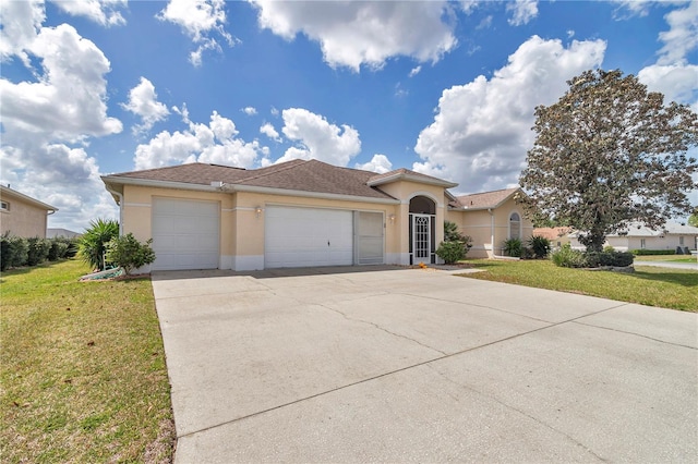 view of front of property with an attached garage, stucco siding, a front lawn, and concrete driveway