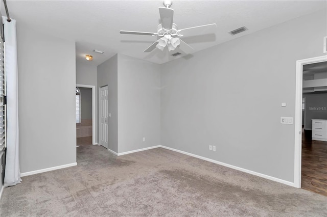 unfurnished bedroom featuring baseboards, visible vents, and carpet floors