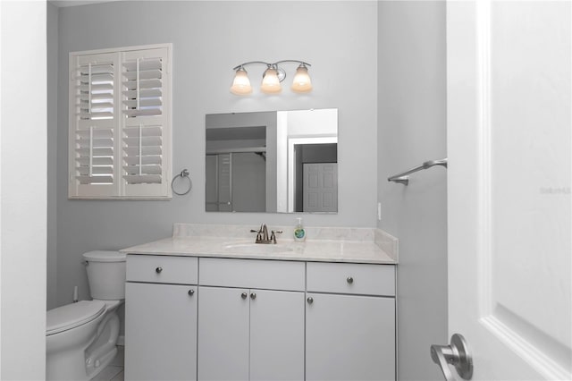 full bathroom featuring an enclosed shower, toilet, and vanity