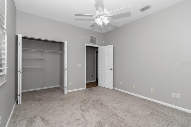 unfurnished bedroom featuring a closet, baseboards, visible vents, and carpet floors