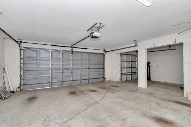 garage featuring a garage door opener