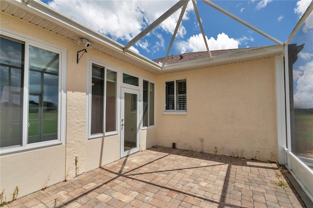 view of patio / terrace with glass enclosure
