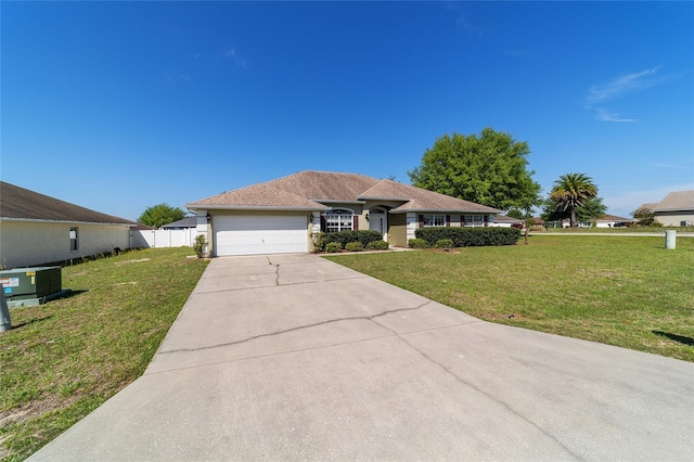 9896 SW 56th Ct, Ocala, FL 34476 - single story home with fence, a garage, a front yard, and driveway