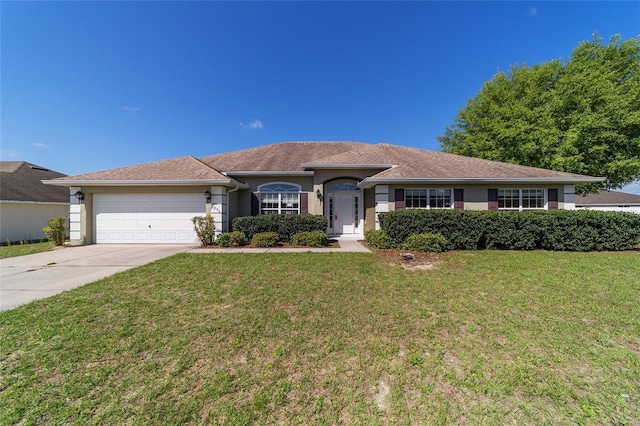 9896 SW 56th Ct, Ocala, FL 34476 - ranch-style house with a garage, concrete driveway, stucco siding, and a front lawn