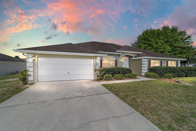 9896 SW 56th Ct, Ocala, FL 34476 - single story home featuring a yard, an attached garage, driveway, and stucco siding