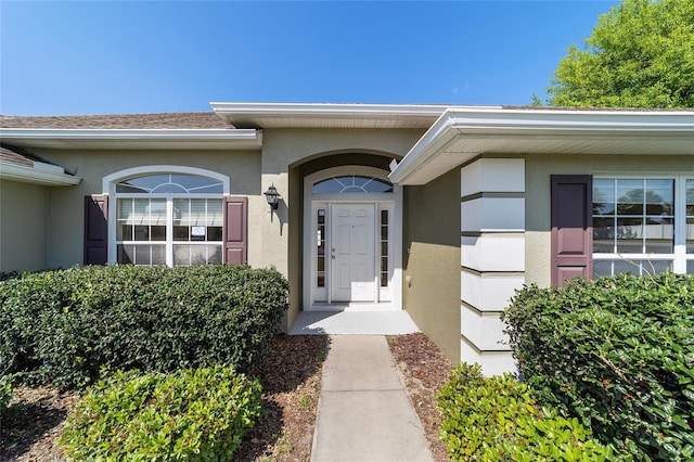 9896 SW 56th Ct, Ocala, FL 34476 - property entrance with stucco siding
