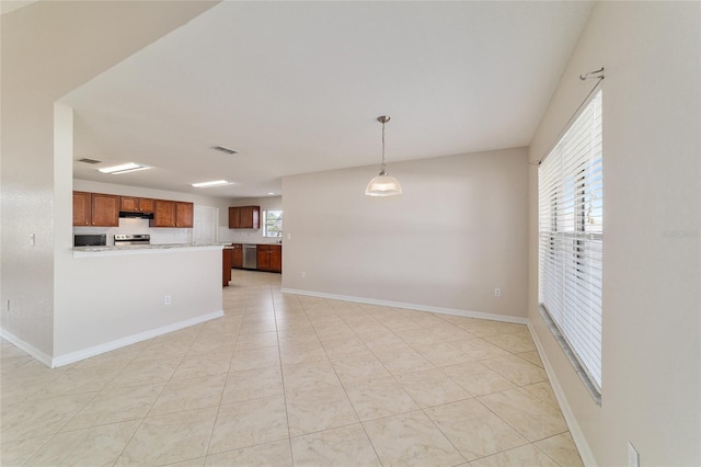 9896 SW 56th Ct, Ocala, FL 34476 - interior space featuring visible vents, under cabinet range hood, light countertops, hanging light fixtures, and stainless steel appliances