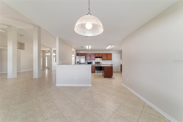 9896 SW 56th Ct, Ocala, FL 34476 - kitchen featuring tasteful backsplash, appliances with stainless steel finishes, light tile patterned flooring, and light countertops