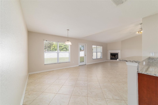 9896 SW 56th Ct, Ocala, FL 34476 - unfurnished living room featuring visible vents, a wealth of natural light, and baseboards