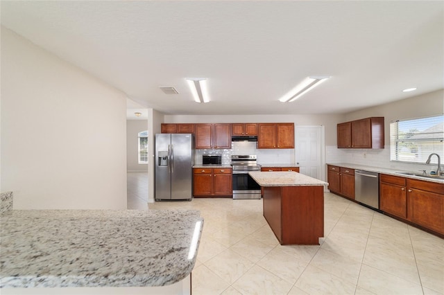 9896 SW 56th Ct, Ocala, FL 34476 - kitchen featuring a sink, backsplash, visible vents, and stainless steel appliances