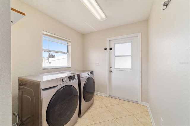 9896 SW 56th Ct, Ocala, FL 34476 - laundry room with laundry area, separate washer and dryer, light tile patterned flooring, and baseboards