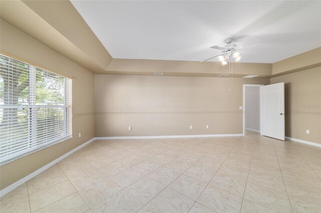 9896 SW 56th Ct, Ocala, FL 34476 - unfurnished room with baseboards, a ceiling fan, and light tile patterned flooring