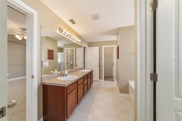 9896 SW 56th Ct, Ocala, FL 34476 - bathroom with a sink, visible vents, double vanity, and tile patterned flooring
