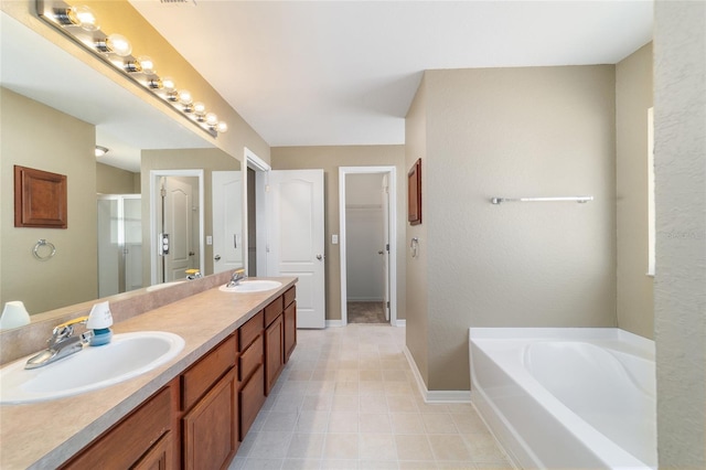 9896 SW 56th Ct, Ocala, FL 34476 - full bath with double vanity, baseboards, a sink, and a stall shower
