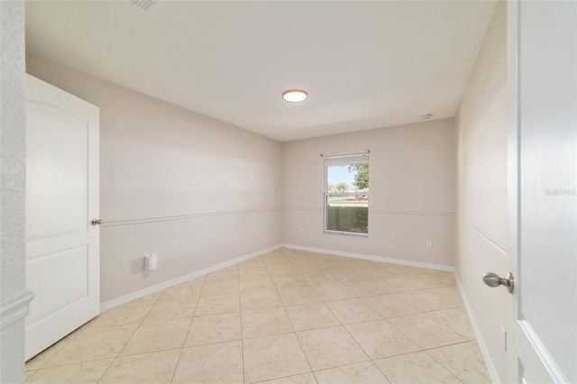 9896 SW 56th Ct, Ocala, FL 34476 - spare room featuring baseboards and light tile patterned flooring