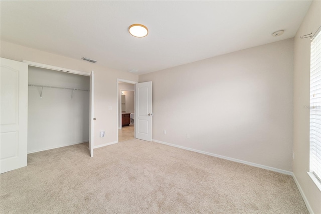 9896 SW 56th Ct, Ocala, FL 34476 - unfurnished bedroom with light carpet, a closet, baseboards, and visible vents