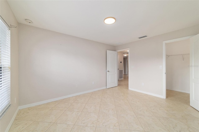9896 SW 56th Ct, Ocala, FL 34476 - unfurnished bedroom with a spacious closet, visible vents, baseboards, and multiple windows