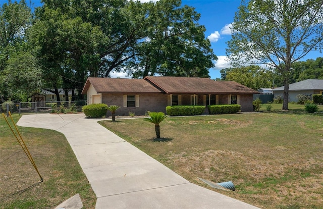 ranch-style home featuring driveway and a garage