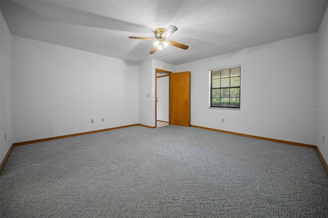 empty room with carpet, baseboards, a ceiling fan, and a textured ceiling