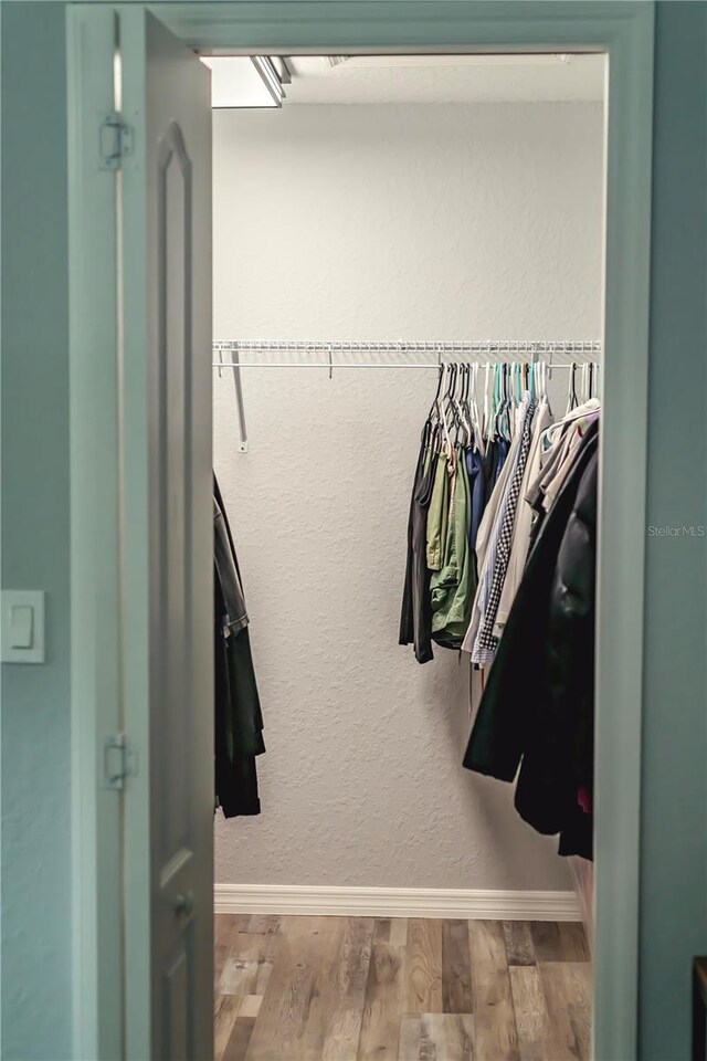 7407 SW 202nd Ct, Dunnellon, FL 34431 - walk in closet with wood finished floors