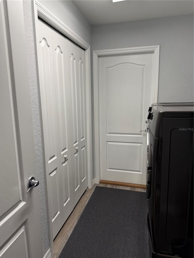7407 SW 202nd Ct, Dunnellon, FL 34431 - laundry area with wood finished floors and washer / clothes dryer