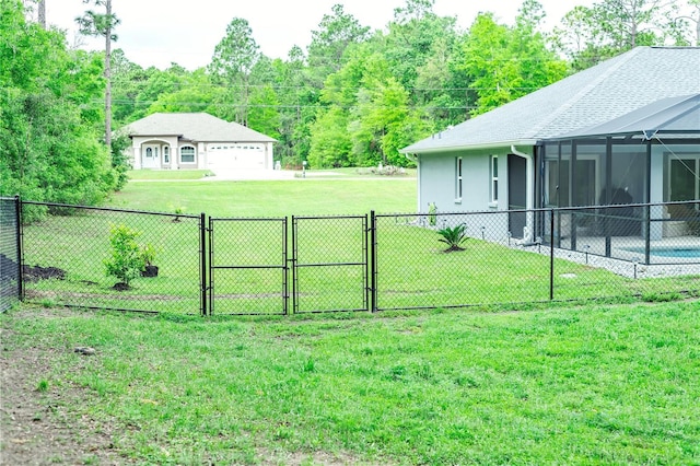 7407 SW 202nd Ct, Dunnellon, FL 34431 - view of yard featuring a gate, a garage, and a lanai