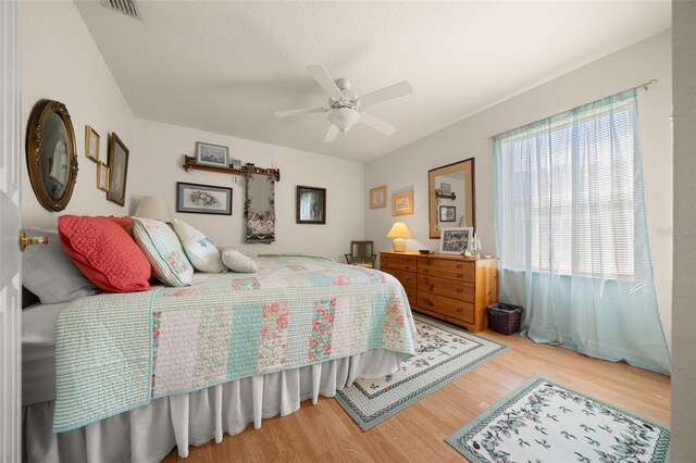 7692 SW 117th Street Rd, Ocala, FL 34476 - bedroom with visible vents, ceiling fan, and wood finished floors
