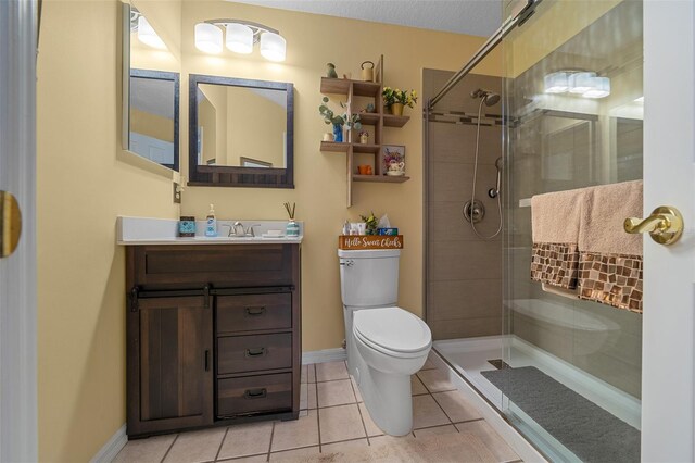 7692 SW 117th Street Rd, Ocala, FL 34476 - bathroom featuring toilet, a stall shower, vanity, and tile patterned floors