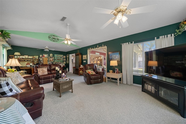 7692 SW 117th Street Rd, Ocala, FL 34476 - living area featuring carpet flooring, visible vents, vaulted ceiling, and ceiling fan