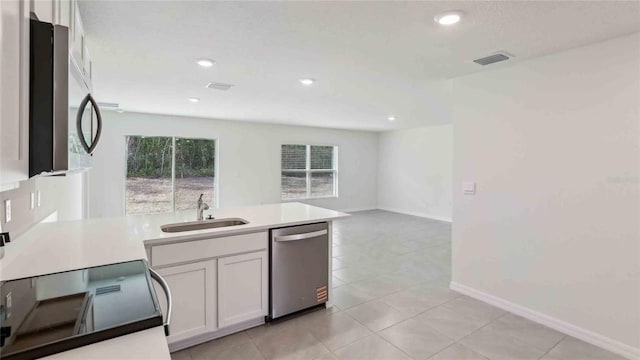 kitchen with a sink, appliances with stainless steel finishes, plenty of natural light, and visible vents