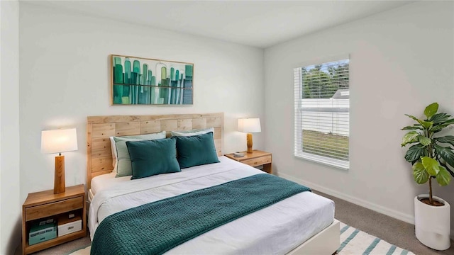 bedroom with carpet floors and baseboards