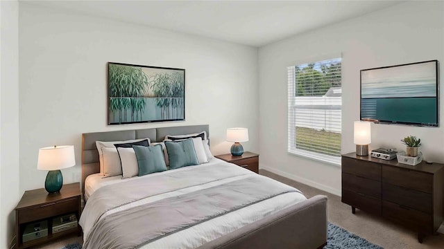 bedroom featuring carpet floors and baseboards