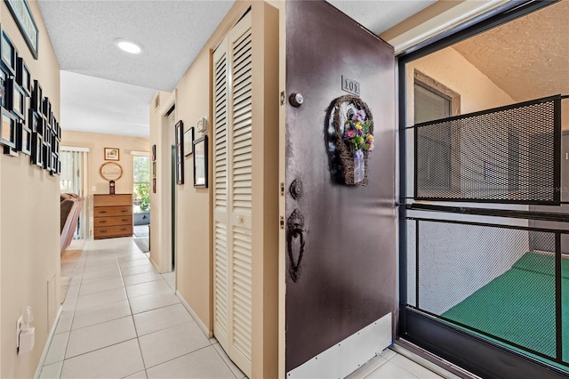 2756 Clubhouse Dr Unit 101, Sarasota, FL 34232 - corridor featuring baseboards and tile patterned flooring
