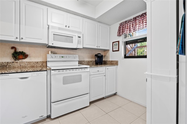 2756 Clubhouse Dr Unit 101, Sarasota, FL 34232 - kitchen with white cabinets, white appliances, and dark stone countertops