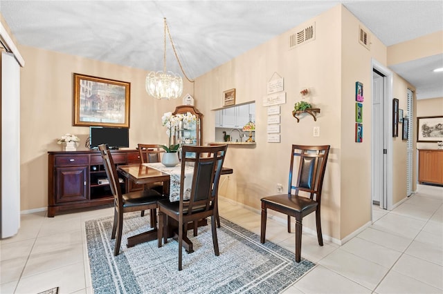 2756 Clubhouse Dr Unit 101, Sarasota, FL 34232 - dining room featuring a chandelier, light tile patterned flooring, and visible vents