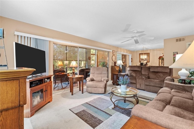 2756 Clubhouse Dr Unit 101, Sarasota, FL 34232 - living area featuring light carpet, visible vents, and ceiling fan