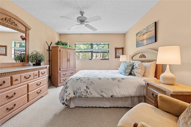 2756 Clubhouse Dr Unit 101, Sarasota, FL 34232 - bedroom featuring a ceiling fan, light colored carpet, and a textured ceiling